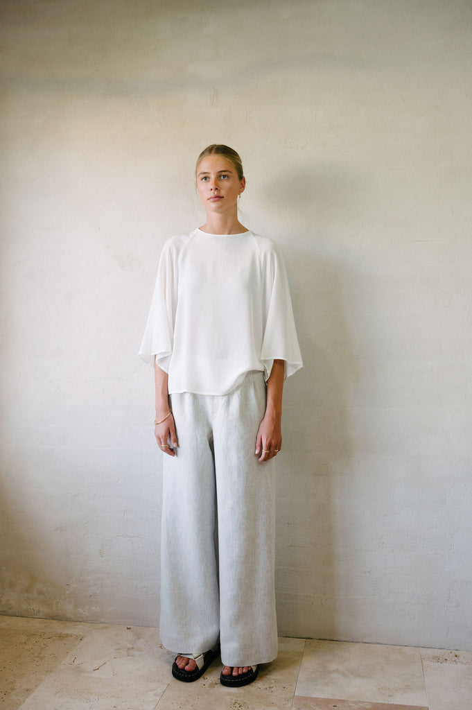 Flared Suit Pants - Natural French Flax Linen | Afar Boutique full height view model looking into the distance 