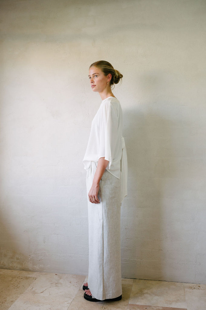 Flared Suit Pants - Natural French Flax Linen | Afar Boutique full height with shirt left side view 
