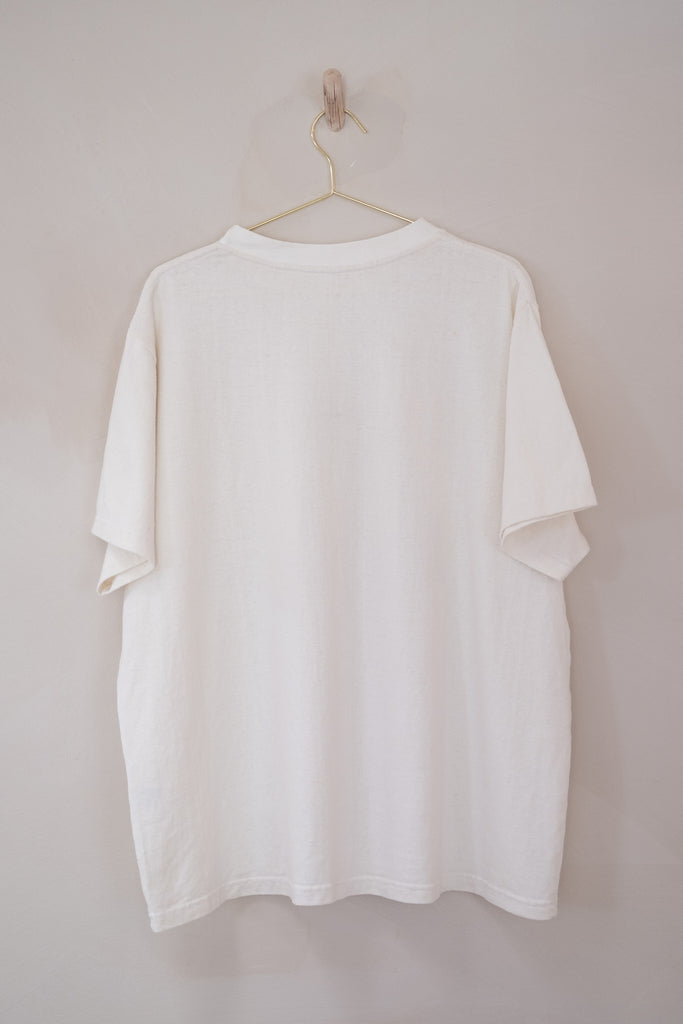 Men’s Afar Tee - White - Hemp/Cotton | Afar Boutique hanging on wall back view 