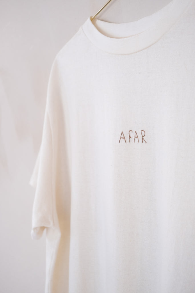 Men’s Afar Tee - White - Hemp/Cotton | Afar Boutique logo close up view 