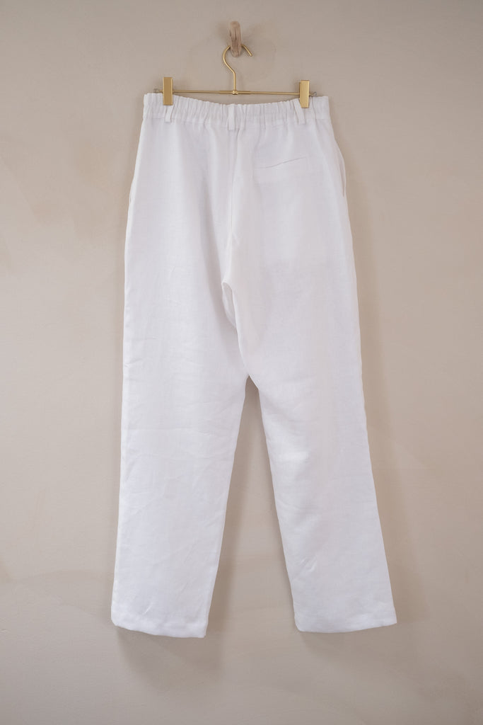 Men’s French Linen Suit Pants - White | Afar Boutique Australia hanging up full length back view 